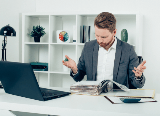 Man staring at employment contract